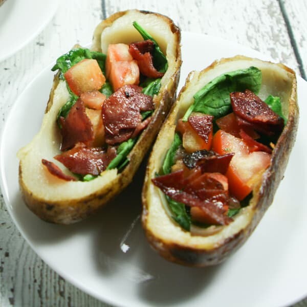 These BLT Whole30 Potato Skins are slathered with ghee and stuffed with spinach, tomatoes and bacon!