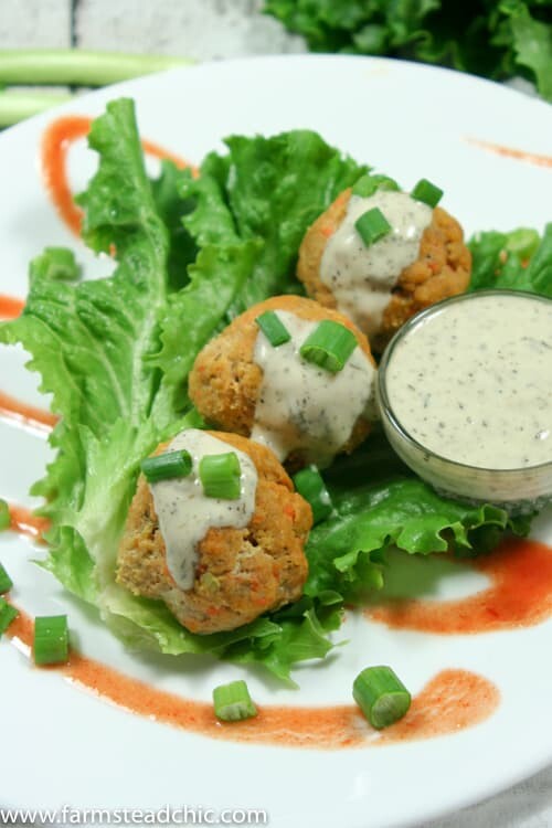 These Paleo and Whole30 Buffalo Chicken Meatballs are the perfect combo of spice + tang + meaty deliciousness. Wrap in gorgeous green lettuce leaves & drizzle with Whole30-approved ranch dressing. You'd never know they are good for you!