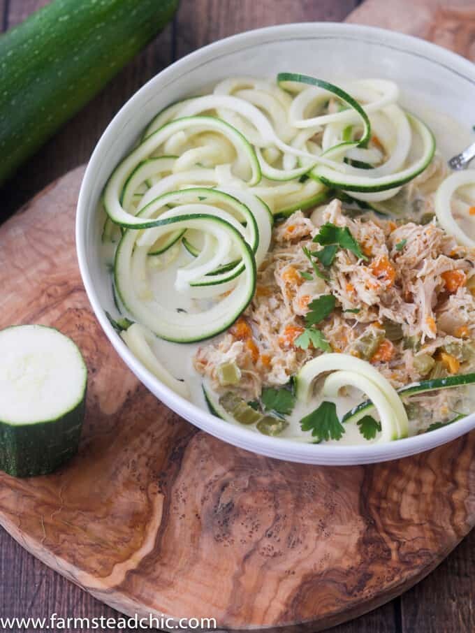 This Paleo and Whole30 Chicken Noodle Soup is gluten-free, grain-free and dairy-free with no added sugar or questionable ingredients. Traditional noodles are replaced with spiralized zucchini, or "zoodles," and the result is an incredibly tasty, truly healthy slow cooker meal with only eight ingredients! 
