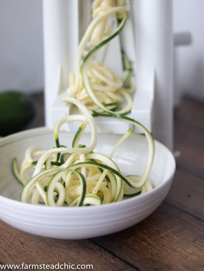 This Paleo and Whole30 Chicken Noodle Soup is gluten-free, grain-free and dairy-free with no added sugar or questionable ingredients. Traditional noodles are replaced with spiralized zucchini, or "zoodles," and the result is an incredibly tasty, truly healthy slow cooker meal with only eight ingredients! 