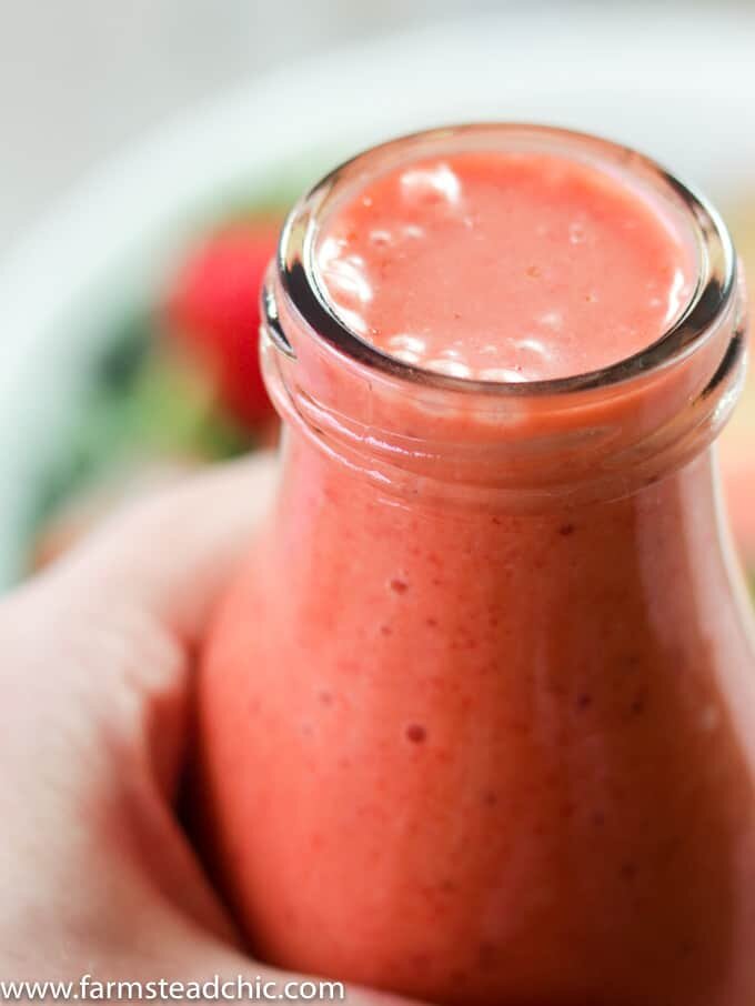 Get this this Paleo and Whole30 Strawberry Vinaigrette Dressing on your springtime dinner table! Made with only fresh strawberries, white wine vinegar, avocado oil and 100% pineapple juice, this fresh summer dressing is cheap, simple and easy. Primal, dairy free and vegetarian + vegan friendly!