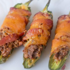 With only ONE net carb and 18g fat, these cheesy bacon-wrapped Low Carb, Keto Jalapeño Poppers are a keto-dieter's dream. They require only 8 ingredients and half an hour. Gluten-free, grain-free with a dairy-free, Whole30 and Paleo option too! The perfect finger food or appetizer!