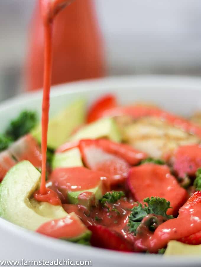 This Paleo and Whole30 Strawberry Avocado Kale Salad has a base of kale. Add grilled chicken to make it a full meal and drizzle with Strawberry Vinaigrette. A simple gluten free, grain free and dairy free superfood meal! Leave off the chicken for a vegetarian and vegan side salad.