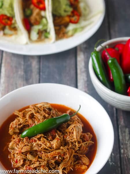 This Paleo and Whole30 Instant Pot Taco Chicken is packed full of flavor with fresh red Anaheim and Serrano peppers along with chili powder and chipotle powder. Coriander, cumin and garlic and onion bring everything into balance and pack a nutritional punch as well. Low carb, Keto-friendly, gluten free, grain free, dairy free.