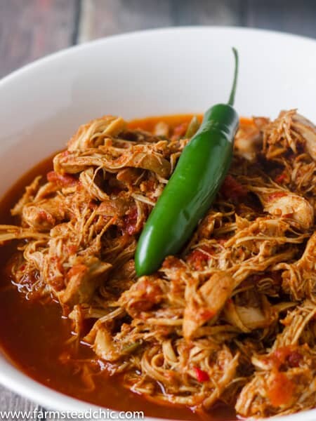 This Paleo and Whole30 Instant Pot Taco Chicken is packed full of flavor with fresh red Anaheim and Serrano peppers along with chili powder and chipotle powder. Coriander, cumin and garlic and onion powder bring everything into balance and pack a nutritional punch as well. Low carb, Keto-friendly, gluten free, grain free, dairy free. Serve onto Whole30-compliant wraps, a bed of leafy greens or a baked sweet potato.