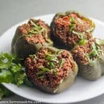 These Paleo and Whole30 Slow Cooker Stuffed Peppers are juicy + full of flavor. So easy and healthy - the perfect weeknight dinner. Low Carb, Primal, Keto, grain-free, gluten-free and dairy-free!