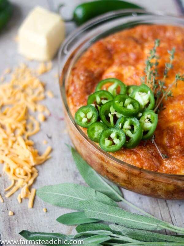 Keto Cheesy Sausage and Jalapeño Casserole with fresh sage and jalapeños, butter and shredded cheddar cheese.