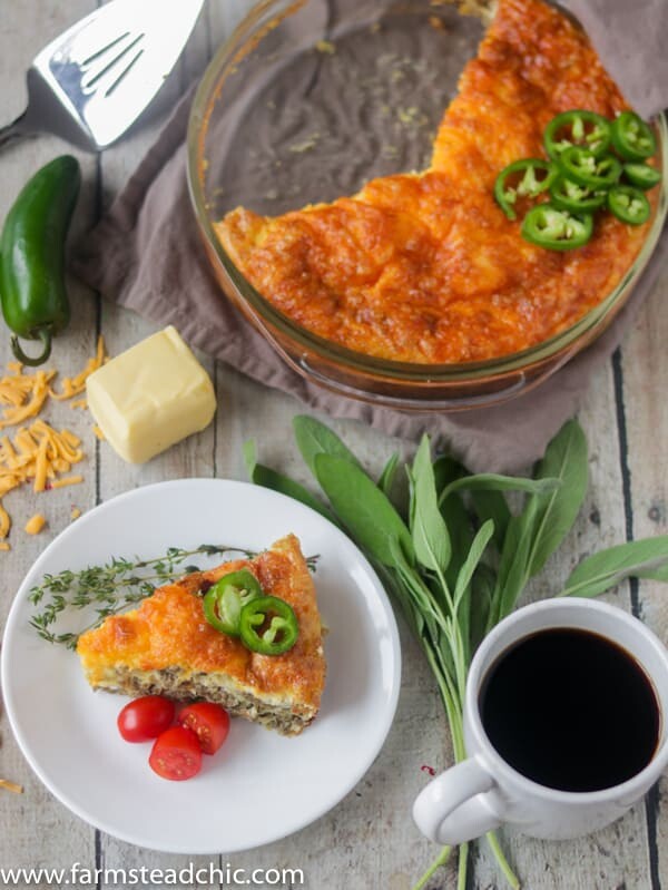 Keto Cheesy Sausage and Jalapeño Casserole with fresh sage and jalapeños, butter and shredded cheddar cheese.