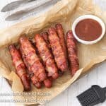 These Low Carb, Keto BBQ Bacon-Wrapped Hot Dogs are sure to be a hit with everyone, especially the kiddos. Who can say no to a grilled hot dog wrapped in bacon and slathered with a sweet and spicy (if you want) barbecue sauce? You only need three ingredients, ten minutes and a grill to get these puppies started. Come on! 
