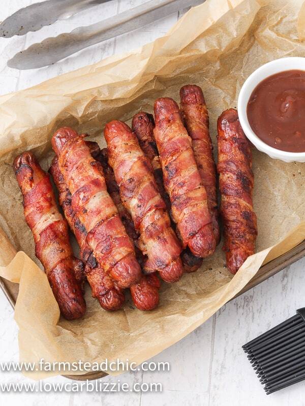 These Low Carb, Keto BBQ Bacon-Wrapped Hot Dogs are sure to be a hit with everyone, especially the kiddos. Who can say no to a grilled hot dog wrapped in bacon and slathered with a sweet and spicy (if you want) barbecue sauce? You only need three ingredients, ten minutes and a grill to get these puppies started. Come on! 