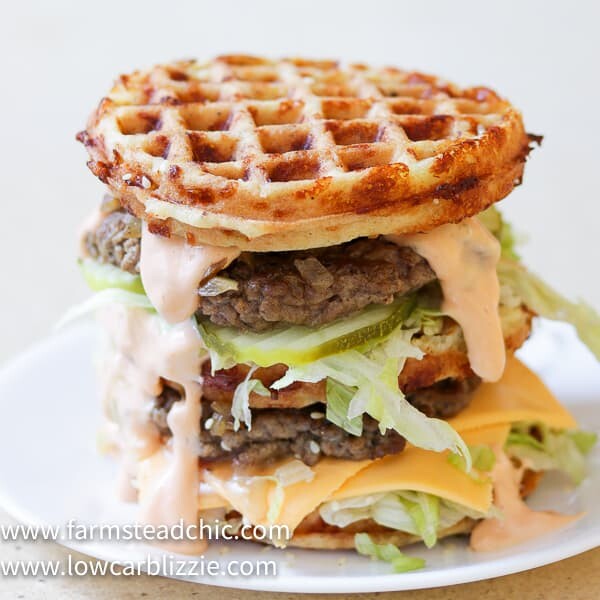 The perfect Chaffle bun, super thin, juicy, perfectly seasoned hamburger patty, crunchy dill pickles, shredded iceberg lettuce, American cheese and Thousand Island dressing make this Keto Big Mac Chaffle taste like the real thing without all the harmful additives and questionable ingredients.  #ketobigmac #bigmacchaffle #lowcarbbigmac #lowcarbburger #chaffle #farmsteadchic 