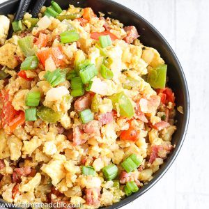 With this Low Carb, Keto Ham Fried Rice (Fried Cauliflower Rice), you can have your takeout and stay low carb too! Freshly riced cauliflower replaces traditional rice, and bell peppers add sweet and savory flavors plus crunch without all the carbs the usual takeout fried rice veggies have. Freshly grated ginger and minced garlic take the whole dish to the next level. #farmsteadchic #CliftyFarm #countryham #southerncooking #ketofriedrice #lowcarbfriedrice #hamfriedrice