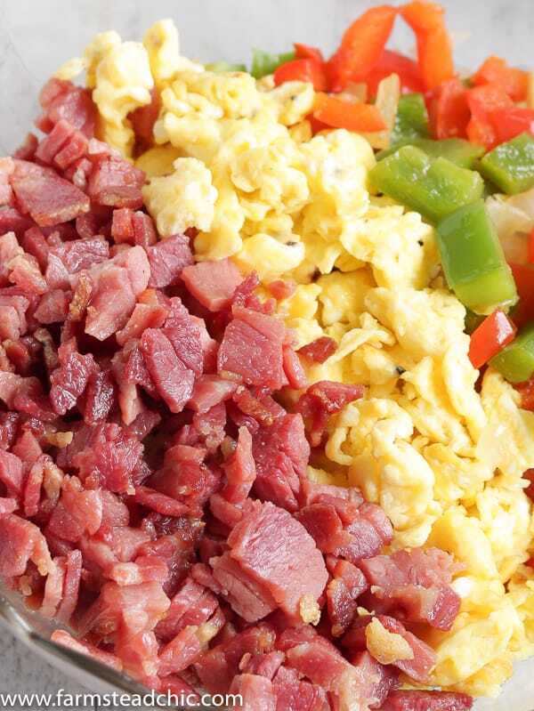 With this Low Carb, Keto Ham Fried Rice (Fried Cauliflower Rice), you can have your takeout and stay low carb too! Freshly riced cauliflower replaces traditional rice, and bell peppers add sweet and savory flavors plus crunch without all the carbs the usual takeout fried rice veggies have. Freshly grated ginger and minced garlic take the whole dish to the next level.  #farmsteadchic #CliftyFarm #countryham #southerncooking #ketofriedrice #lowcarbfriedrice #hamfriedrice