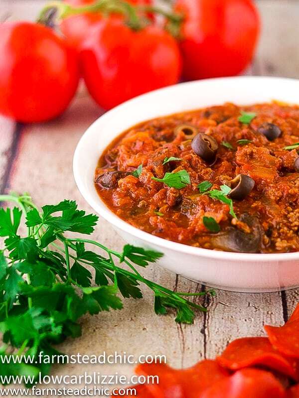 This Low Carb, Keto Pizza Soup with a Whole30 and Paleo option is the perfect warm and cozy meal for a chilly fall evening. With onions, green bell pepper, mushrooms, olives, marinara sauce and plenty of meat, it will satisfy your pizza craving without all the time and effort of those low carb pizza crusts. | www.farmsteadchic.com | #farmsteadchic #ketosoup #lowcarbsoup #ketopizza #lowcarbpizza #pizzasoup