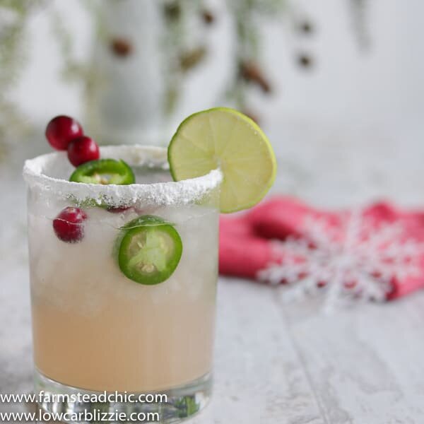 This Low Carb, Keto Spicy Cranberry Margarita is the perfect guilt-free holiday cocktail! Fresh cranberries and jalapeños add a special twist to the traditional margarita. Orange extract and a little water replace the traditional sugar-laden orange liqueur. | www.farmsteadchic.com #ketococktail #lowcarbcocktail #ketomargarita #lowcarbmargarita #spicymargarita #holidaymargarita #Christmascocktail