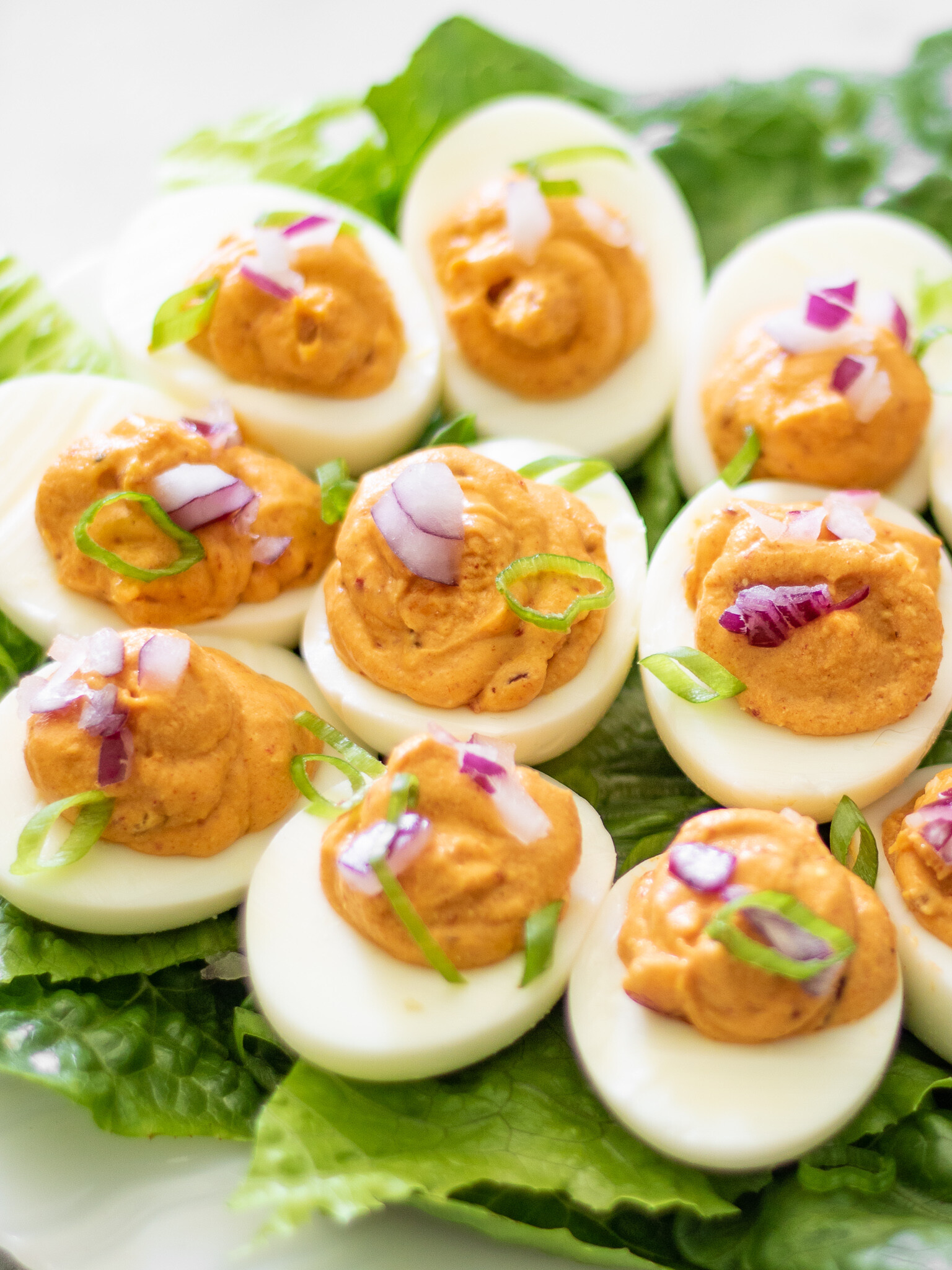 These Korean kimchi keto deviled eggs are a spicy and flavorful twist on traditional deviled eggs. Made with only four ingredients (plus S&P), they a super simple, naturally low carb and keto-friendly appetizer or snack.